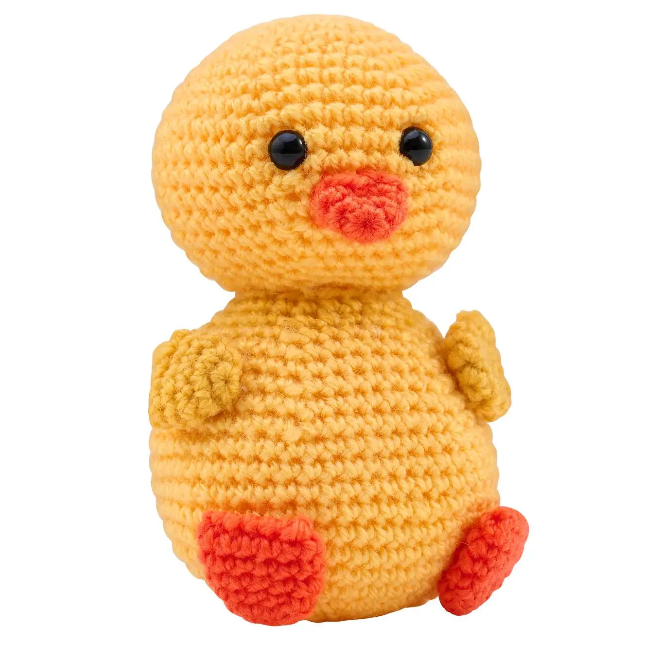 Crocheted yellow duck toy with black eyes and red beak and feet on a white background